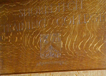 College shield on lectern
